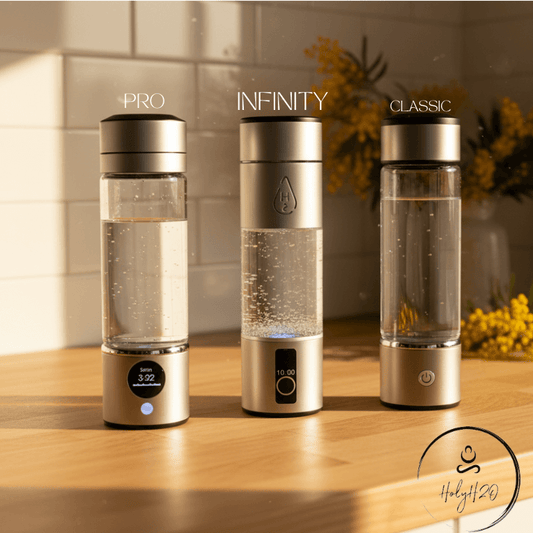 Three water bottles labeled 'Pro', 'Infinity', and 'Classic' on a wooden surface with a blurred background.