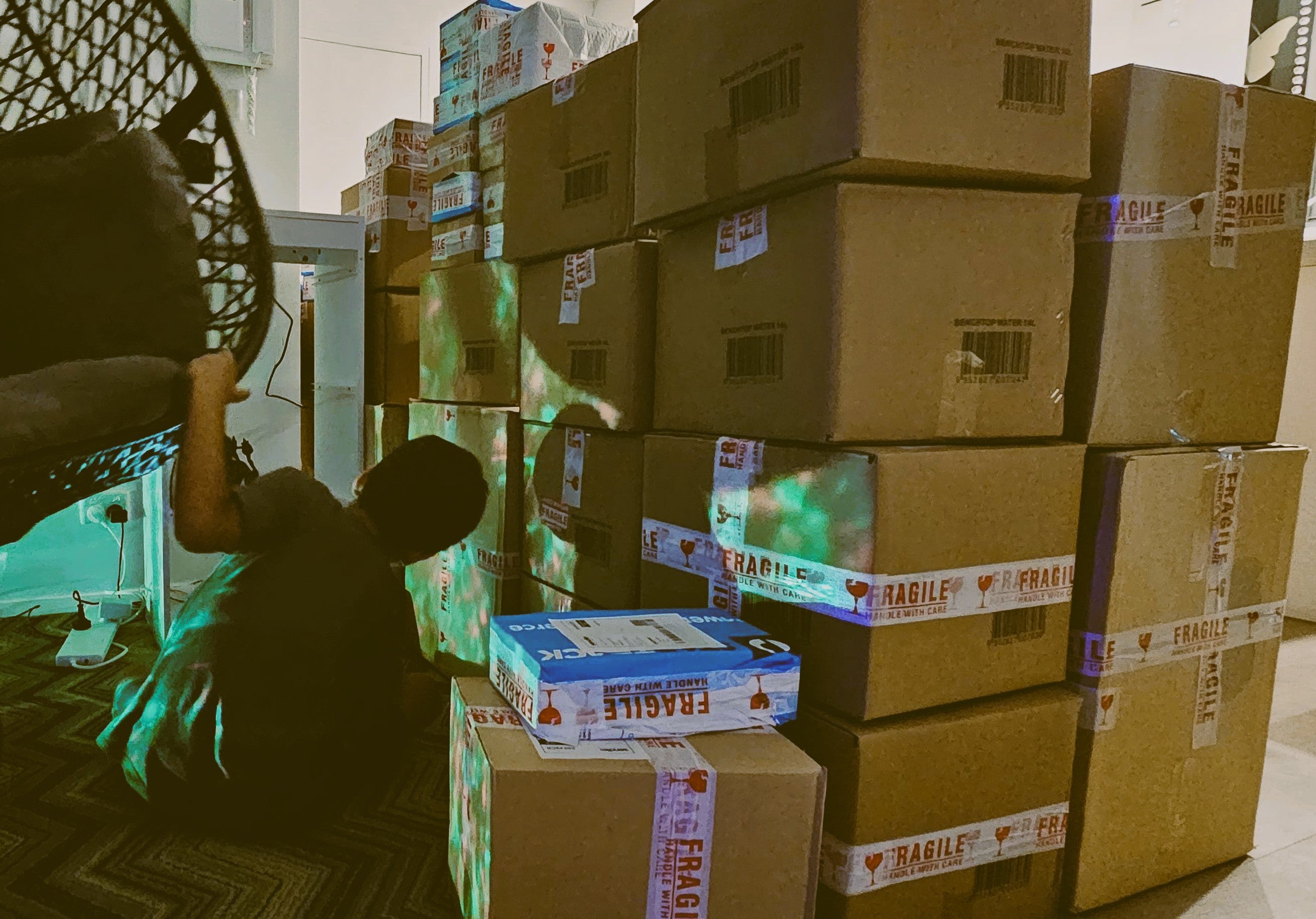Early HolyH₂O orders being packed by hand in Sydney